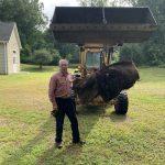 Frank Matta with an old carpet buried for years near the Blackstone River